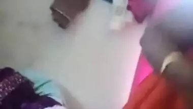 Fatty Indian woman takes off orange dress to join husband for sex