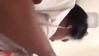 Girl performs XXX show and pulls up white T-shirt to expose boobs
