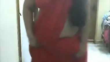 Horny desi bhabi showing boobs and fingering pussy in red saree
