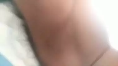 Tanned teen sucks dick and laps up cum off bed. Jazz Bikini eats candy off cock