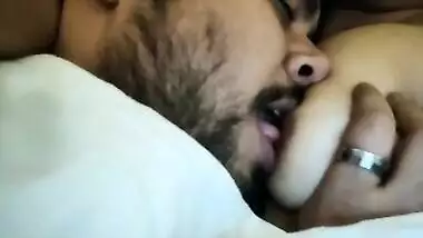 Bearded dude enjoys sucking Desi wife's sweet XXX nipples in MMS vid