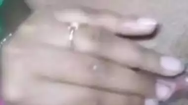 Desi bitch pulls pink dress up to XXX finger her wet hairy pussy