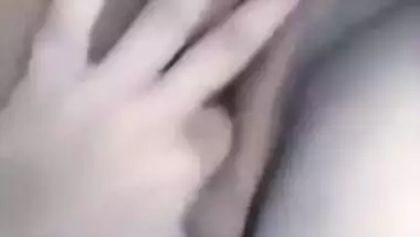 Horny Desi gal displays saggy tits and also fingers her XXX cunny