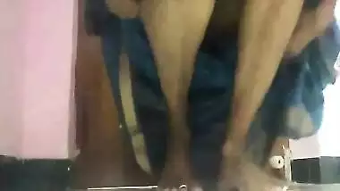 Amateur porn video where Desi MILF lifts blue dress to play with pussy