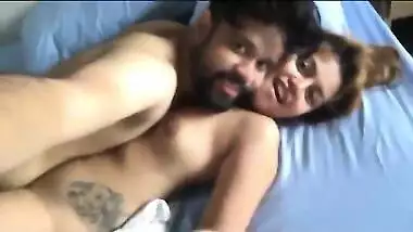 Female from India lies in bed with sex admirer with naked XXX boobs
