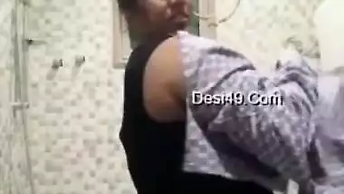 Titillating Indian housewife reveals her small XXX boobs for a bit