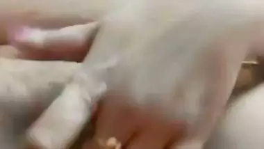 Chubby, young lady enjoys fingering her shaved pussy