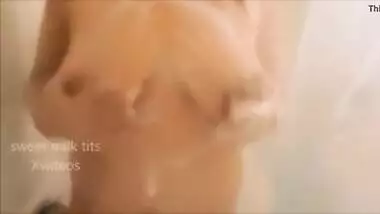 Milf playing with lactating milky tits in shower. Tit squeezing nipple lick