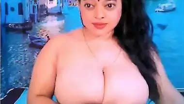 Indian slut sits in front of webcam with naked massive natural tits