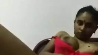 Sexy Indian girl pulls sex red lingerie down to flash her XXX titties