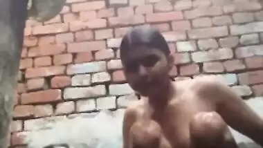 Young desi woman sets the camera on and starts her XXX shower show